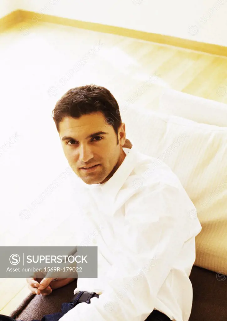 Man sitting on sofa, portrait