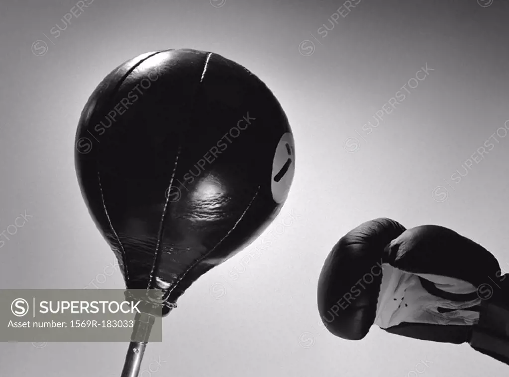 Boxing glove and punch ball, close-up, b&w
