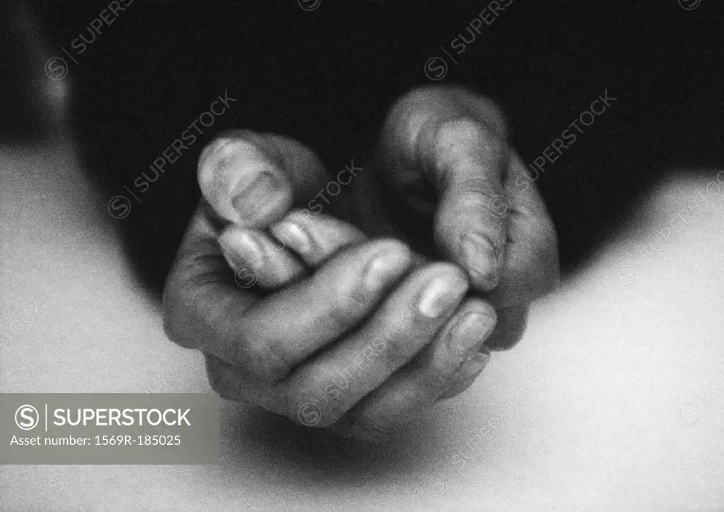 Hands cupped, close-up, b&w