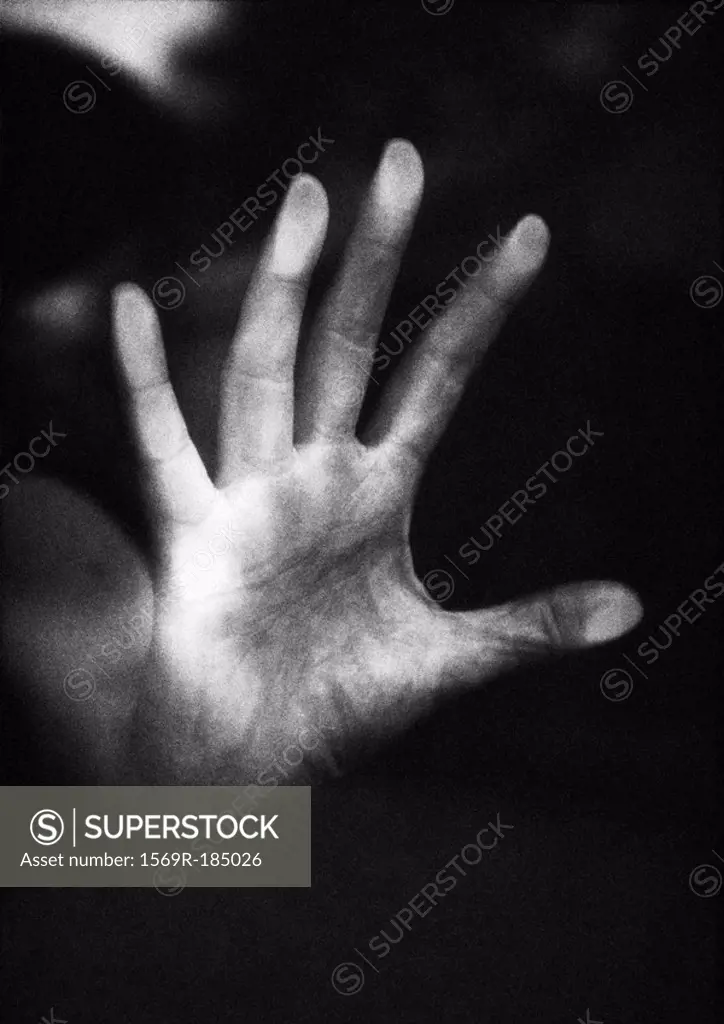 Hand pressing against glass, close-up, b&w