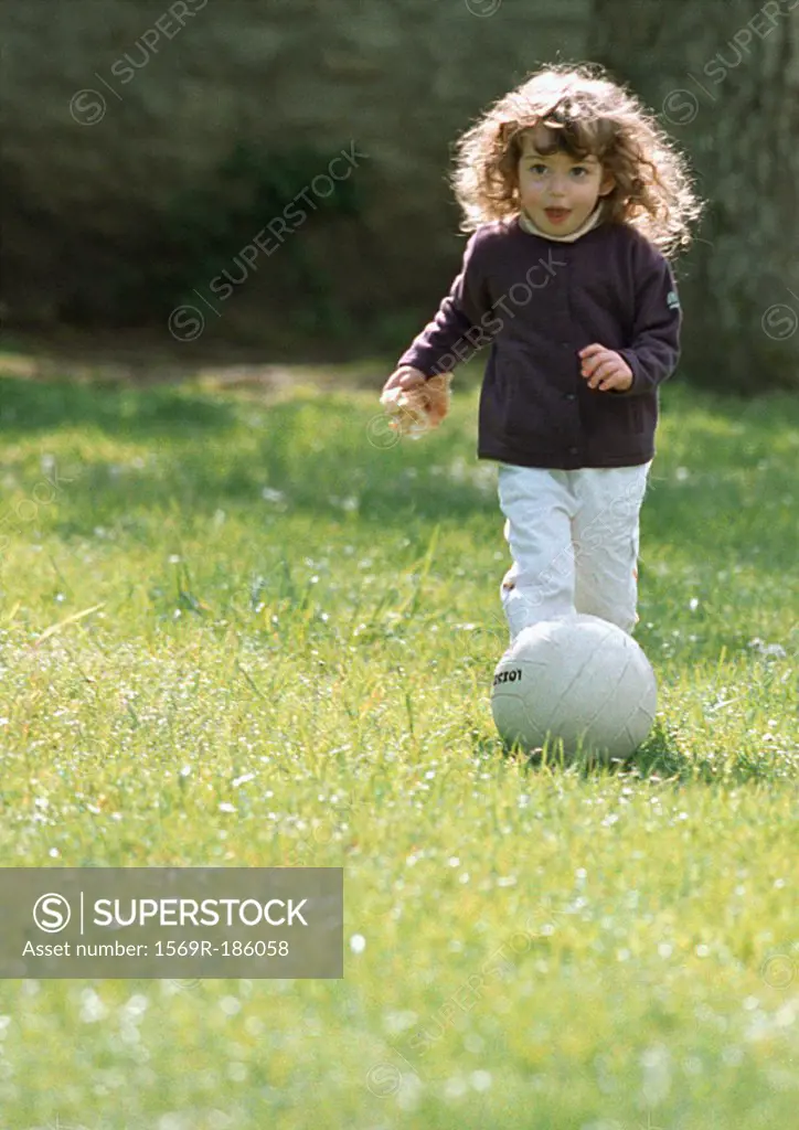 Child playing with soccer ball