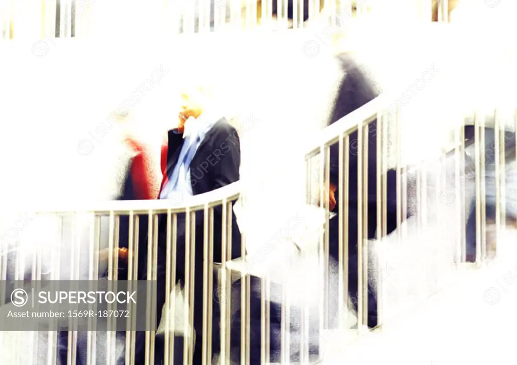 Businessman on stairs, blurred