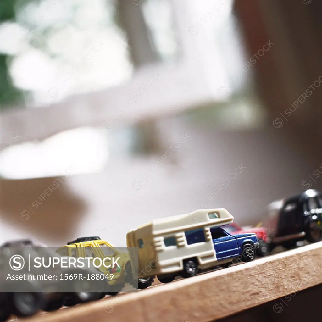 Toy cars lined up on table