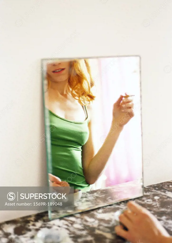 Woman´s reflection in mirror