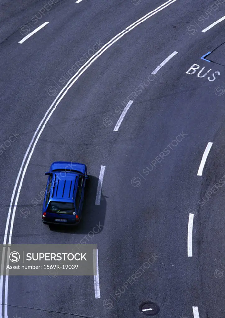 Blue car on highway, birdseye view