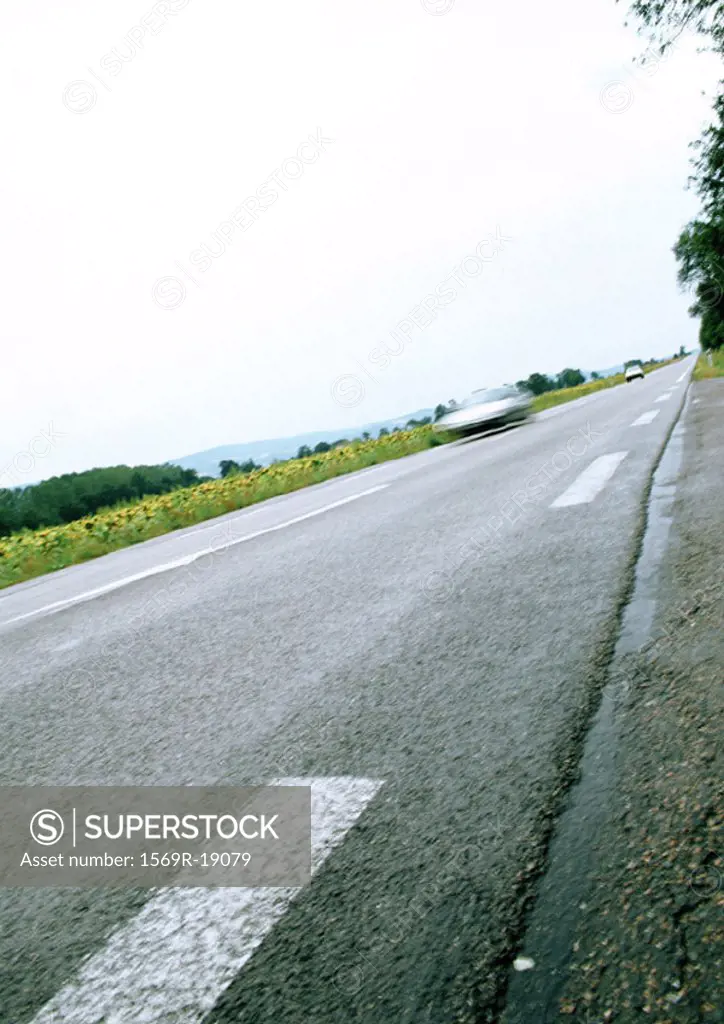 White lines on road, low angle view, tilt