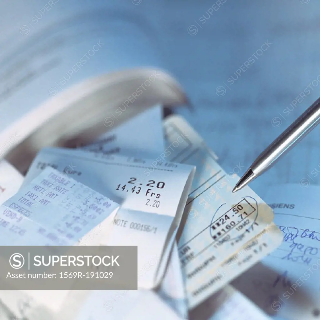 Pen above tickets and sales receipts