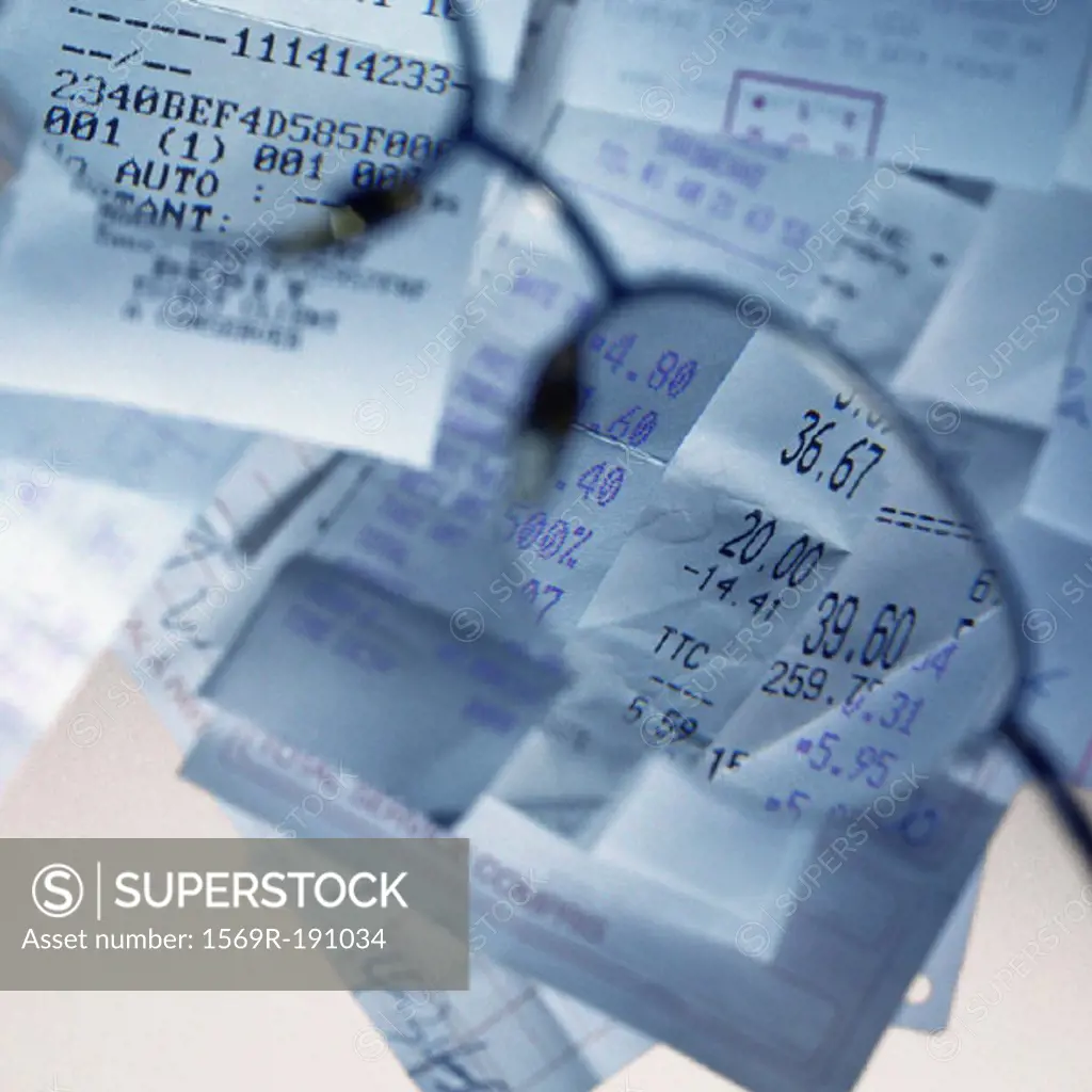 Sales receipts viewed through glasses