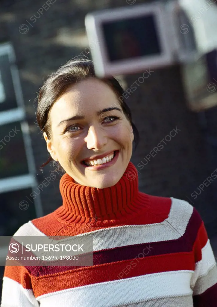 Woman in turtleneck smiling