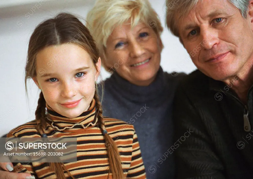 Grandparents and granddaughter, portrait