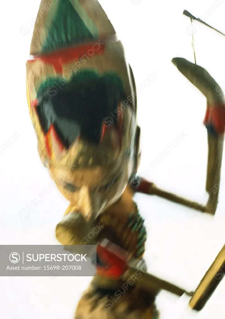 Colorful wooden marionette, close-up