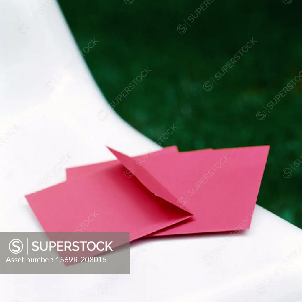 Red envelopes, on white chair