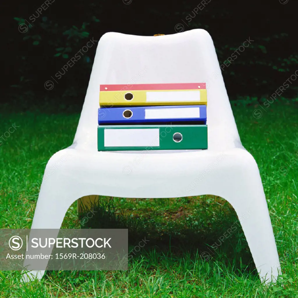 Files on plastic chair