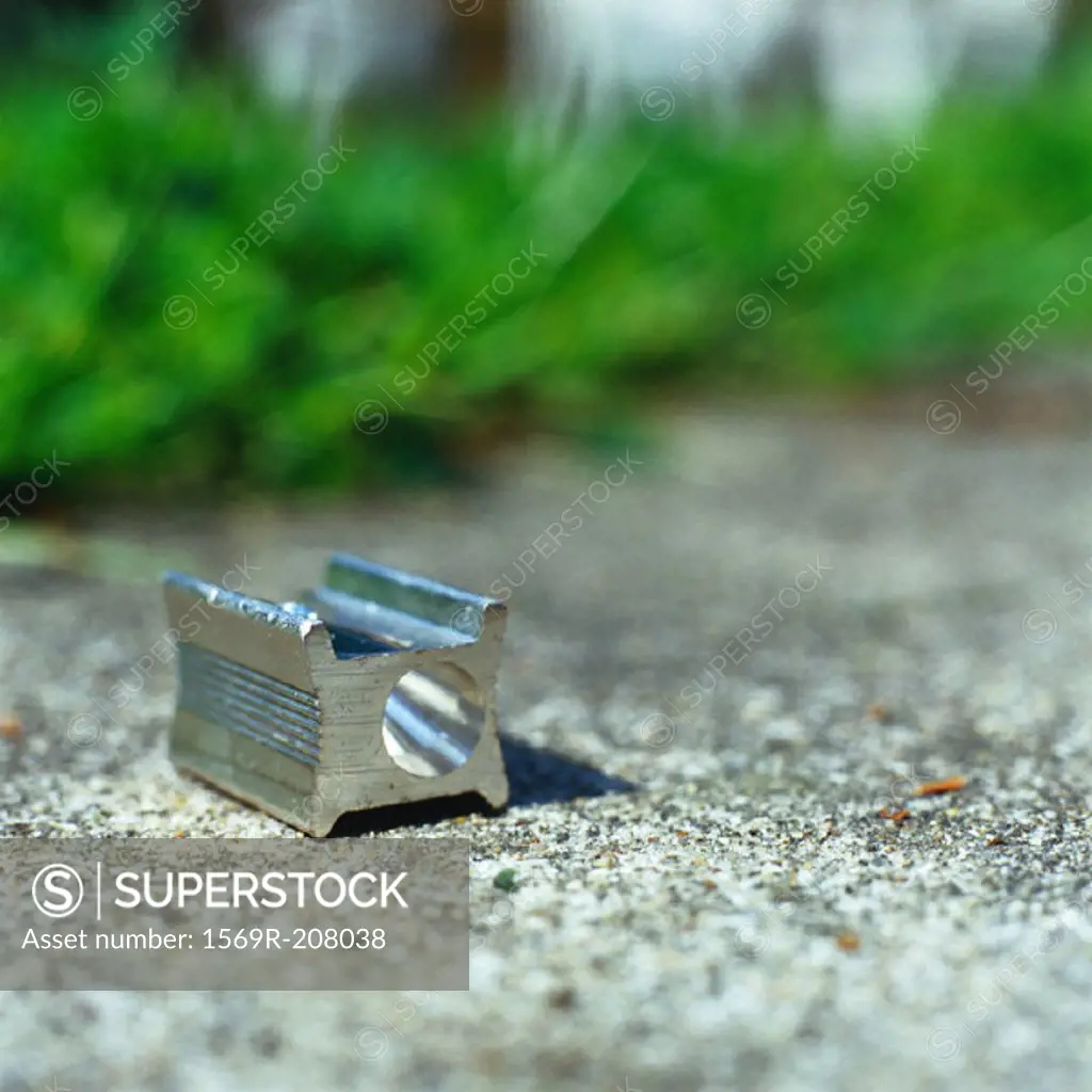 Pencil sharpener on ground