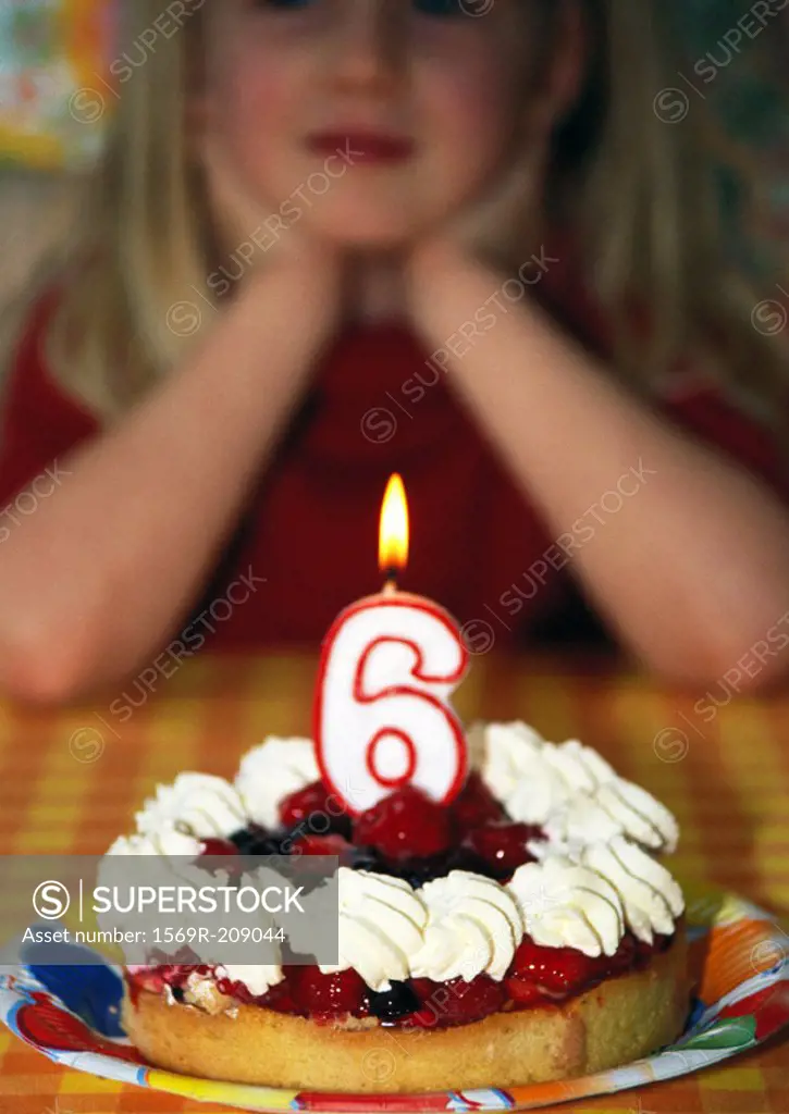 Little girl with birthday cake, portrait