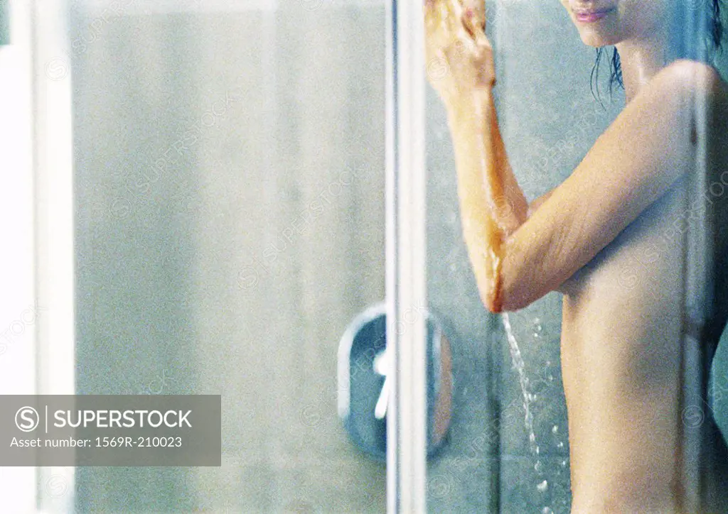 Woman in shower, partial view