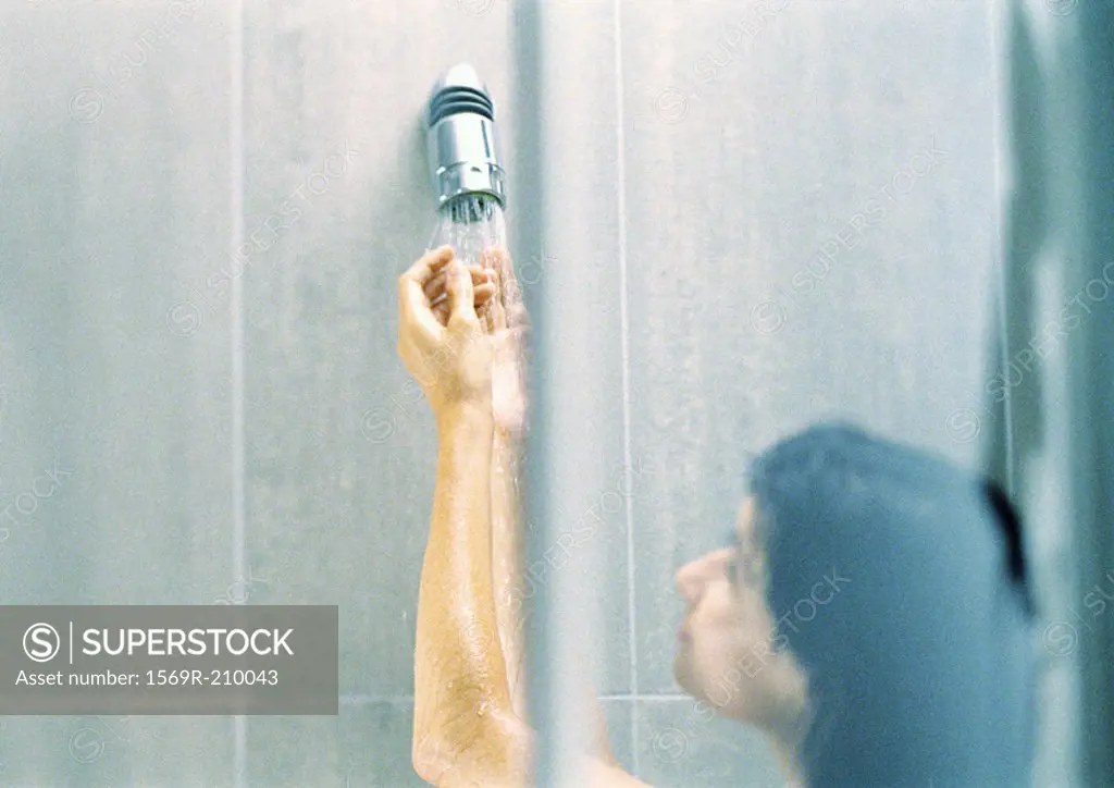 Woman in shower, blurred, close-up