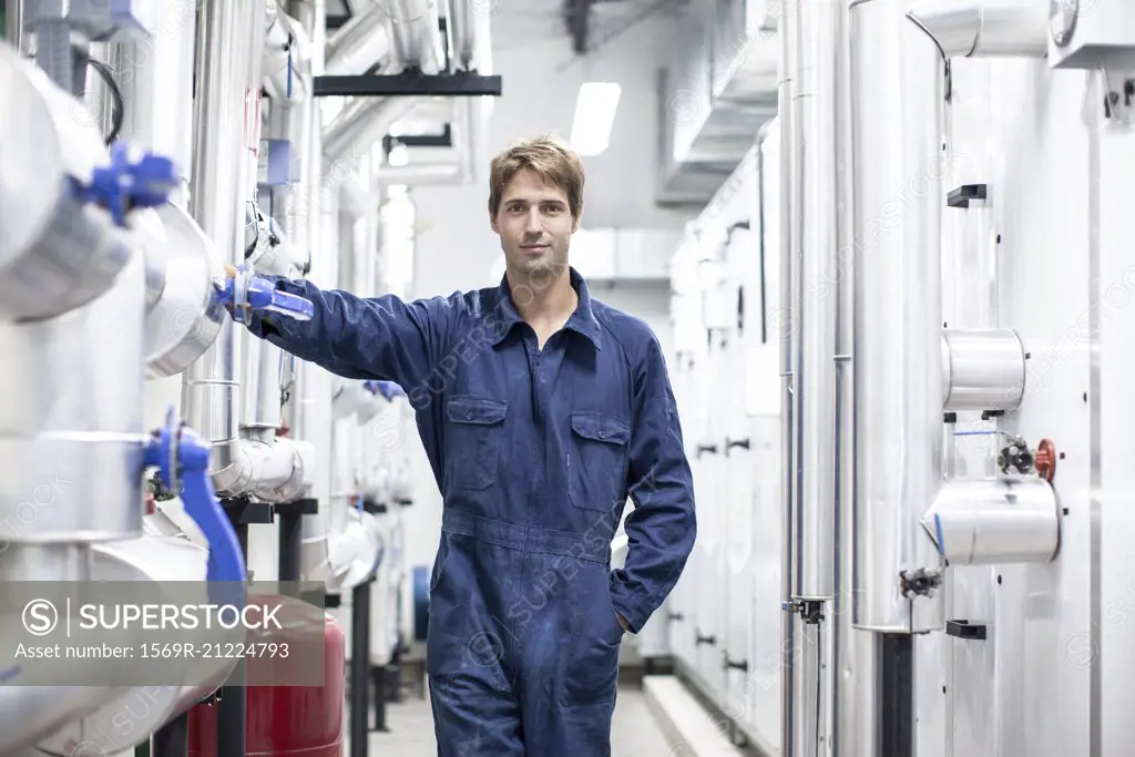 Skilled worker in industrial plant, portrait