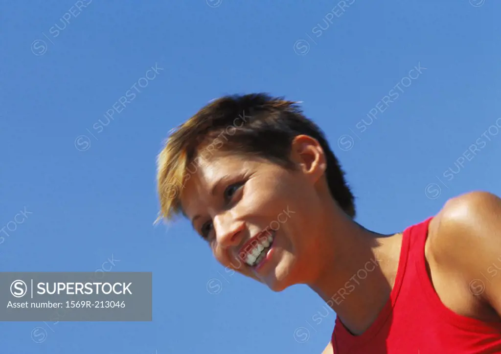 Portrait of woman smiling, low angle view