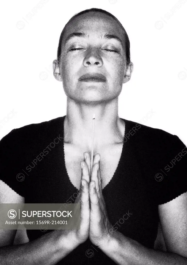 Woman praying, portrait, b&w