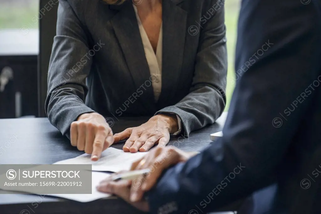 Business people discussing paperwork