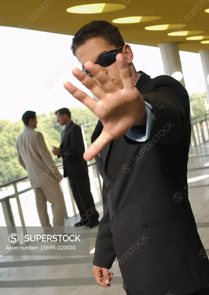 Businessman, holding hand out