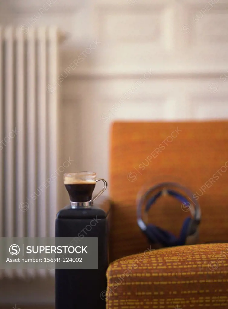 Chair with headphones and cup placed on it