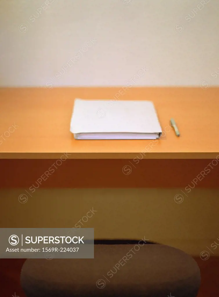 Pen and book on desk