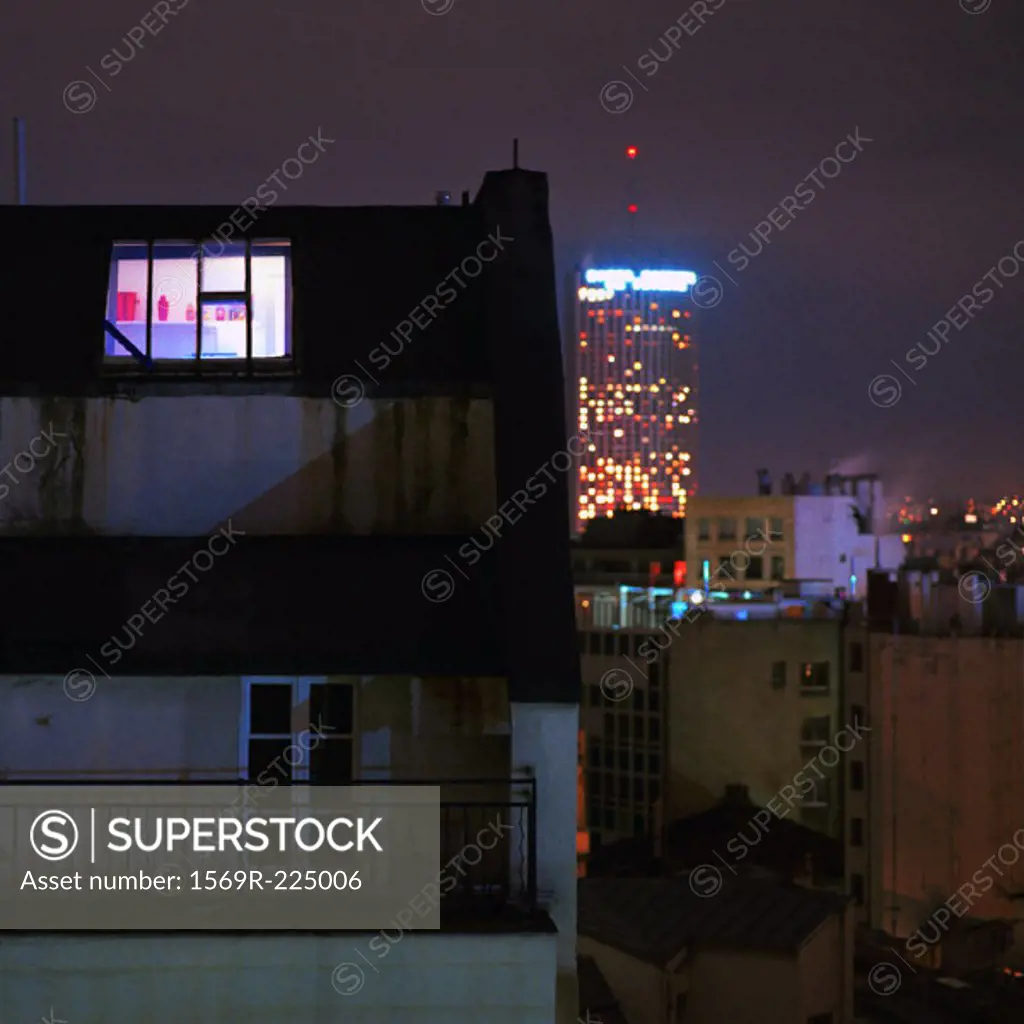 Apartment, buildings lit up at night