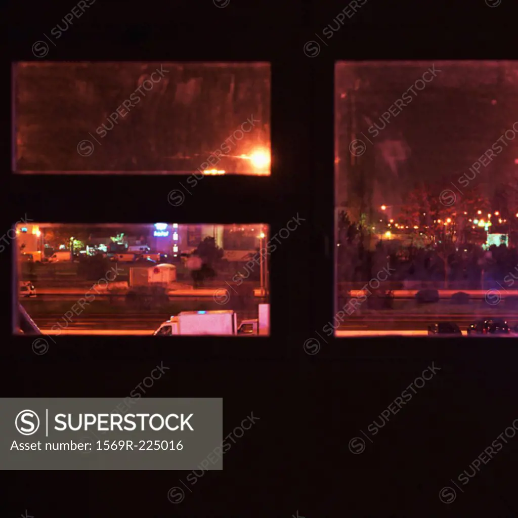 City street, seen through window at night, elevated view