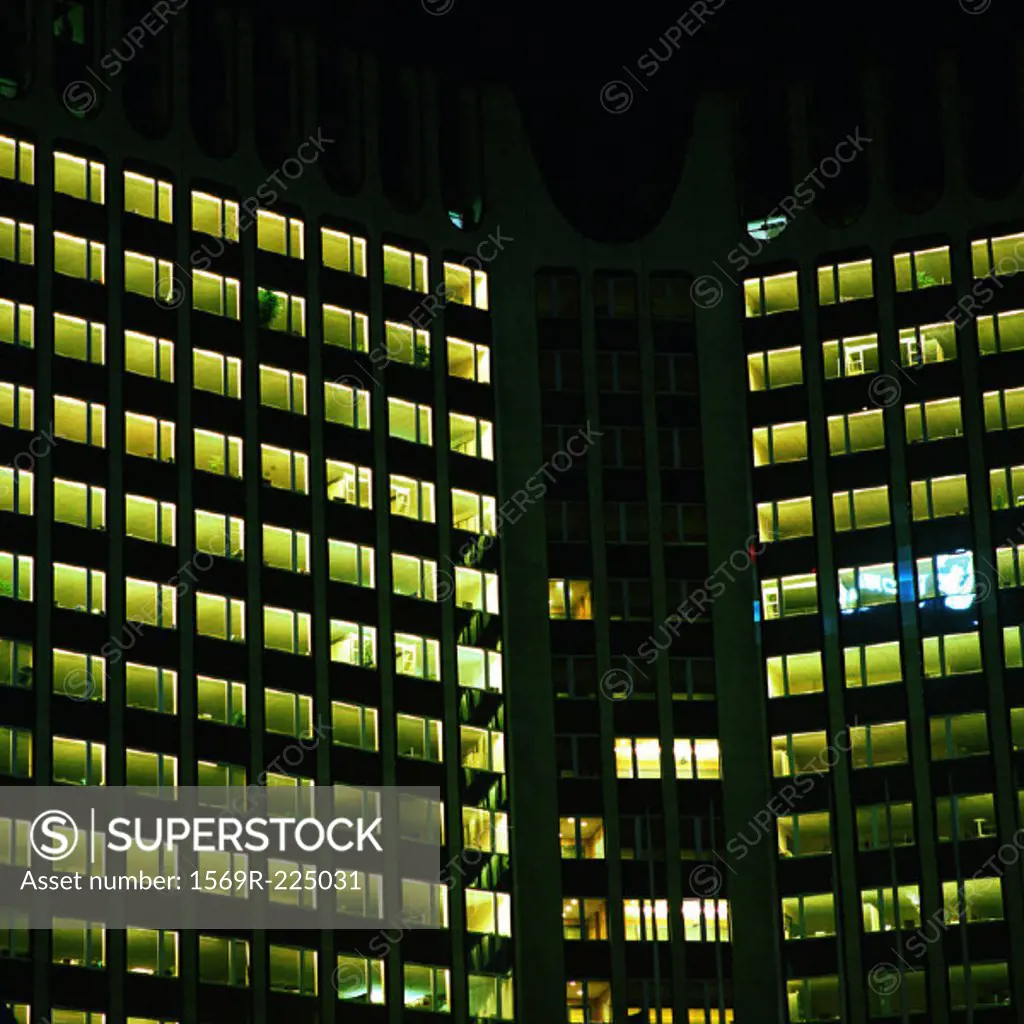 Office buildings lit up at night, exterior