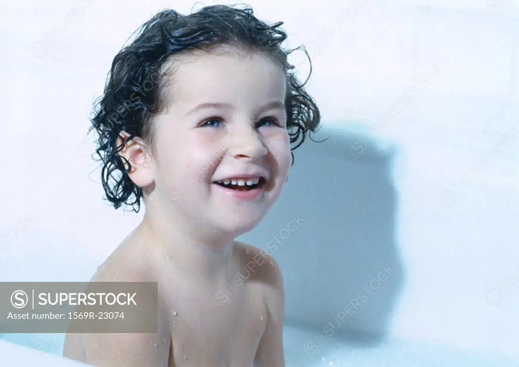 Child in bathtub, portrait