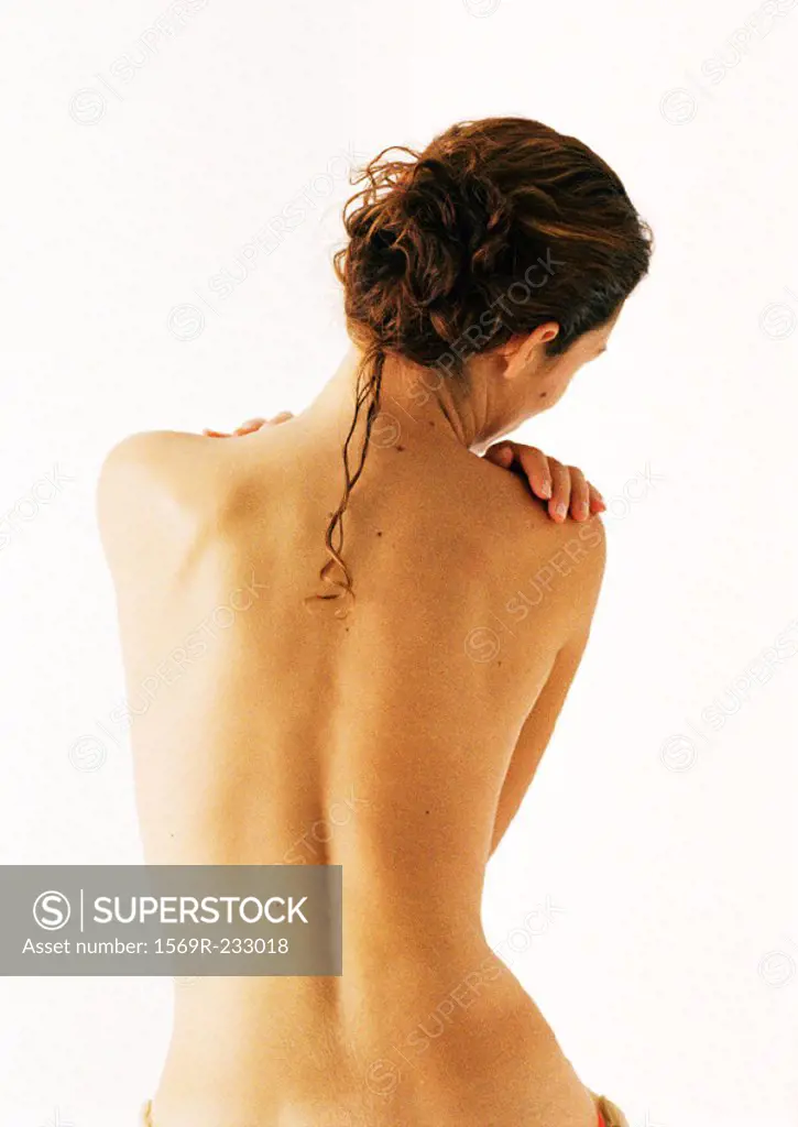 Nude woman, waist up, rear view