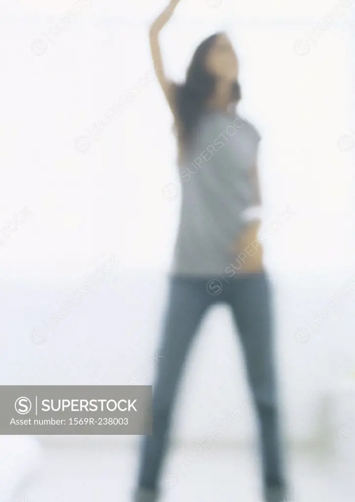 Silhouette of young woman, blurred