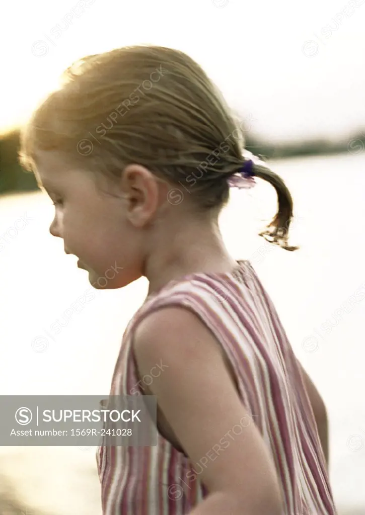 Girl with ponytail, side view