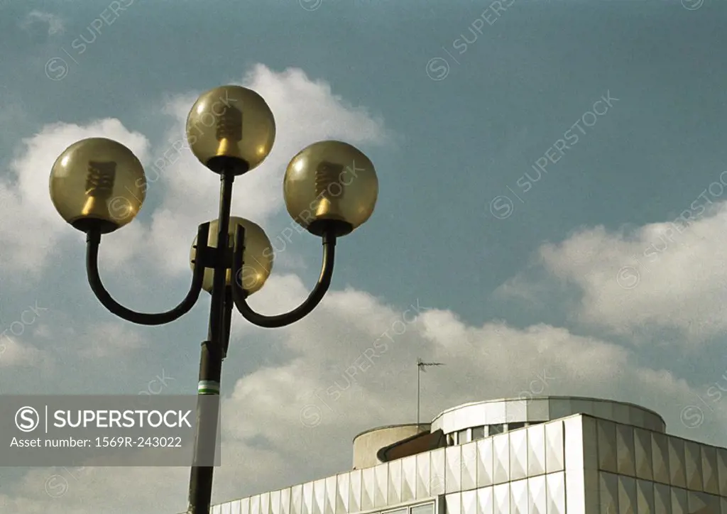 Street lamp and building, low angle view