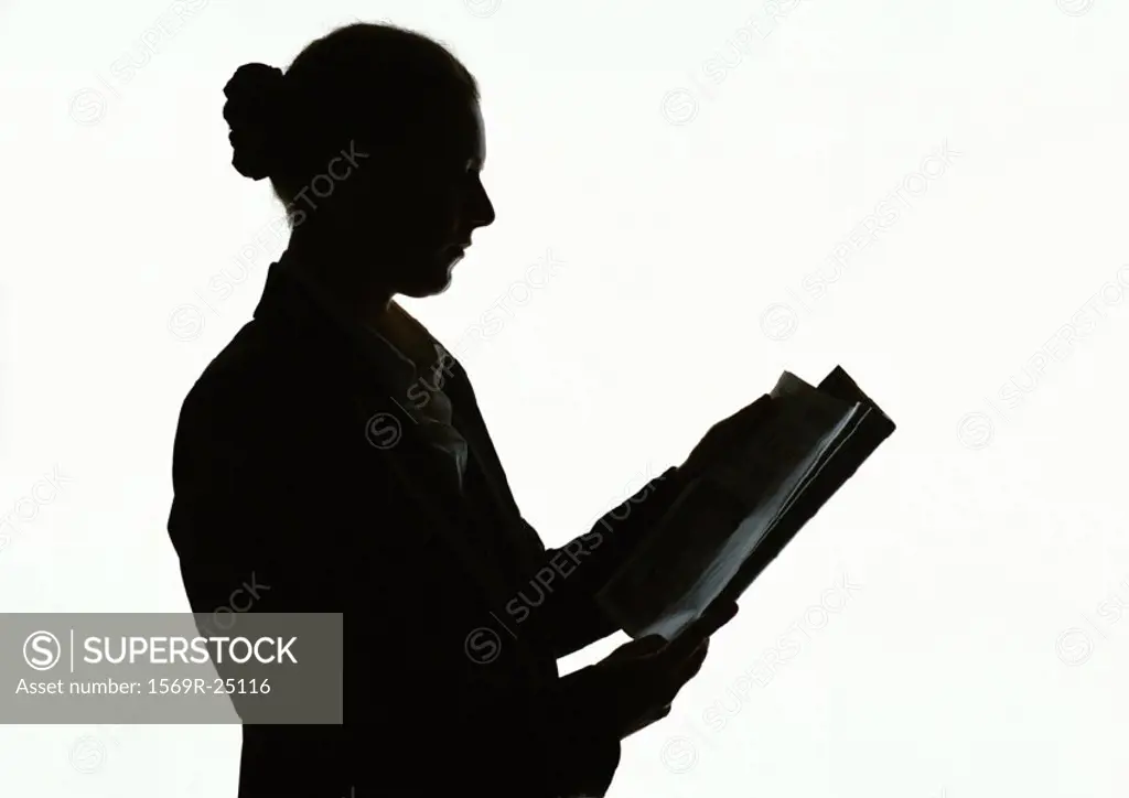 Woman reading, silhouette