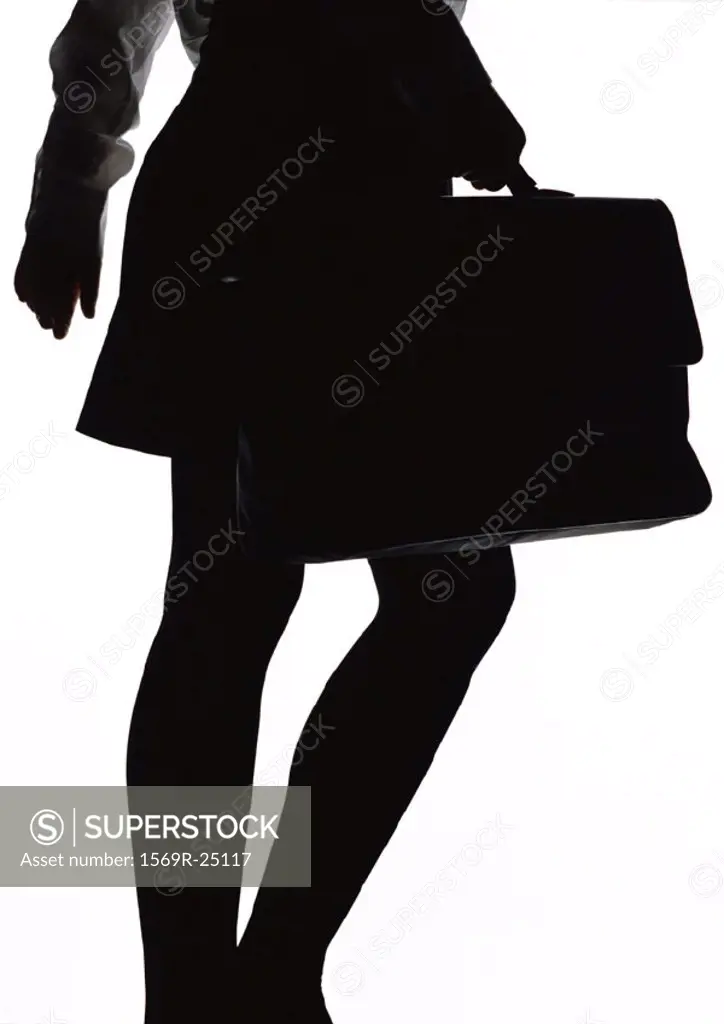 Woman walking with briefcase, silhouette