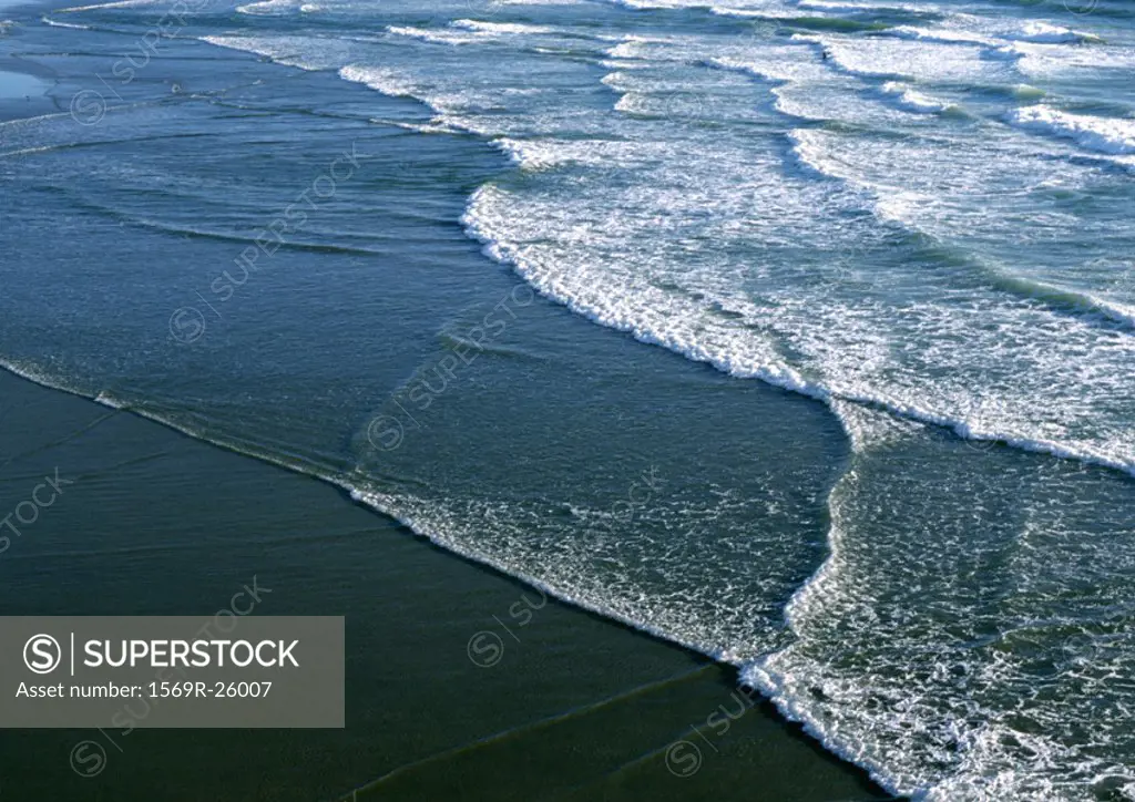 California, surf washing up on shore, close-up