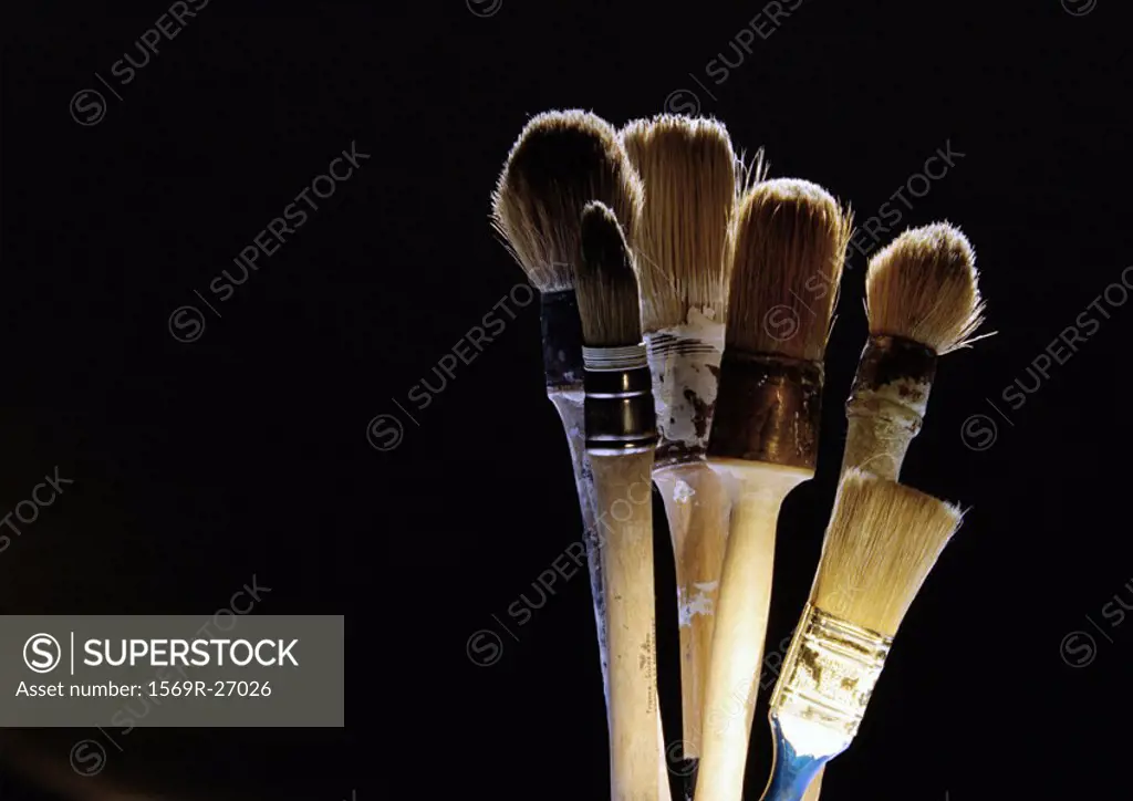 Paintbrushes on black background