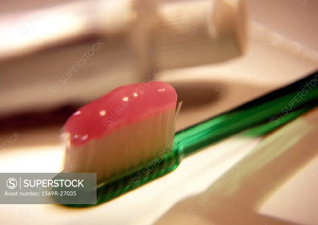 Toothpaste on toothbrush head, close-up