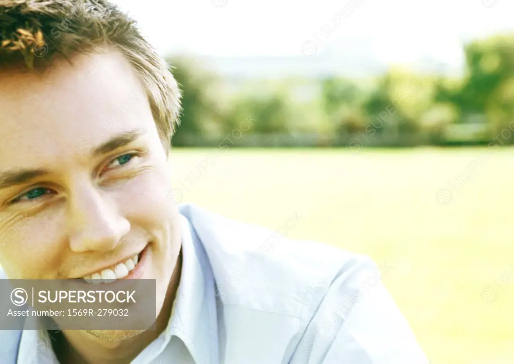 Young man smiling, close-up, portrait