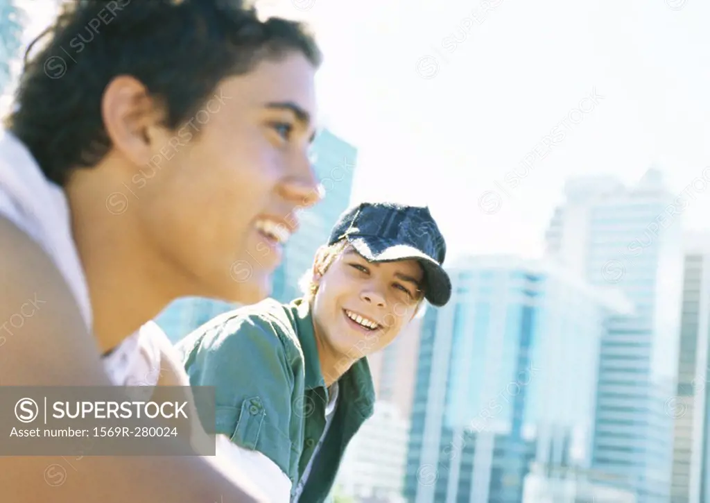 Two teenage boys in city setting