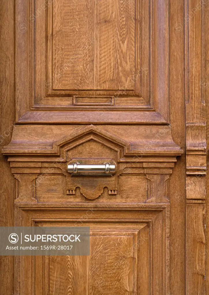 Wood door with metal handle