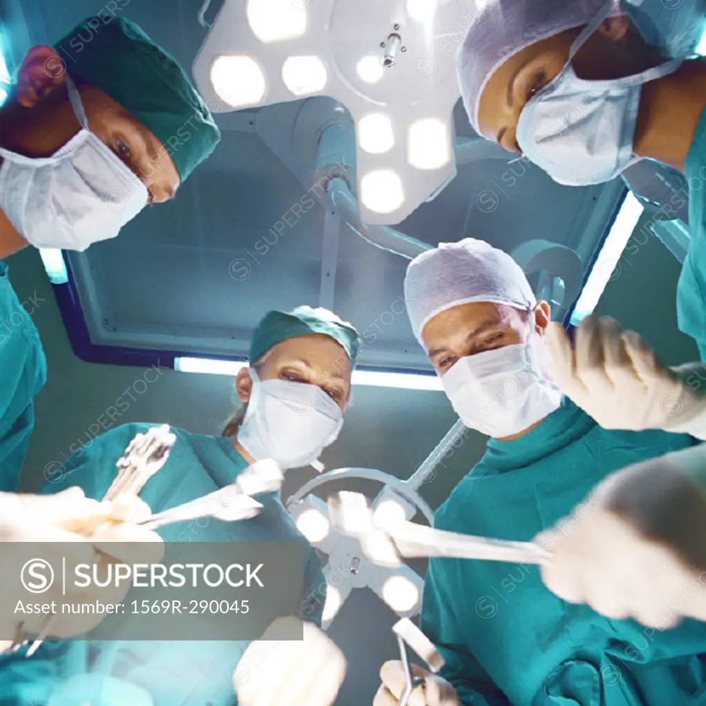 Surgical team preparing to operate, low angle view