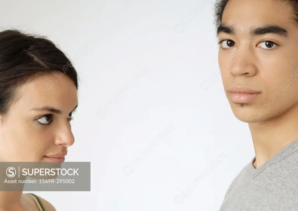 Young couple, woman looking at man, close-up