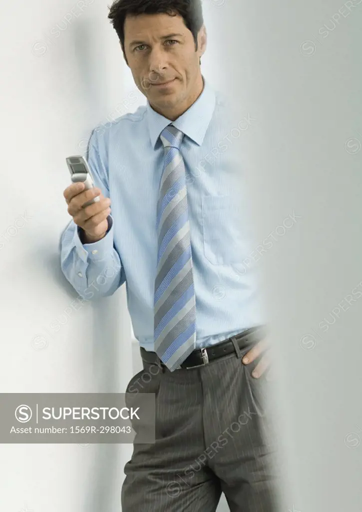 Businessman holding cell phone
