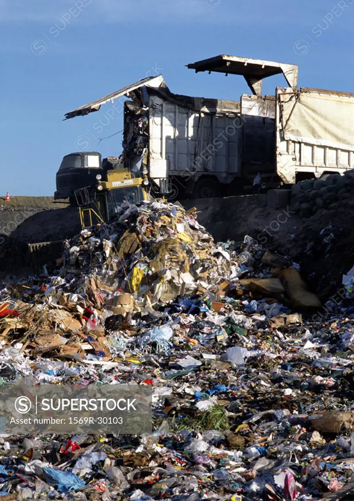 Truck dumping trash in landfill