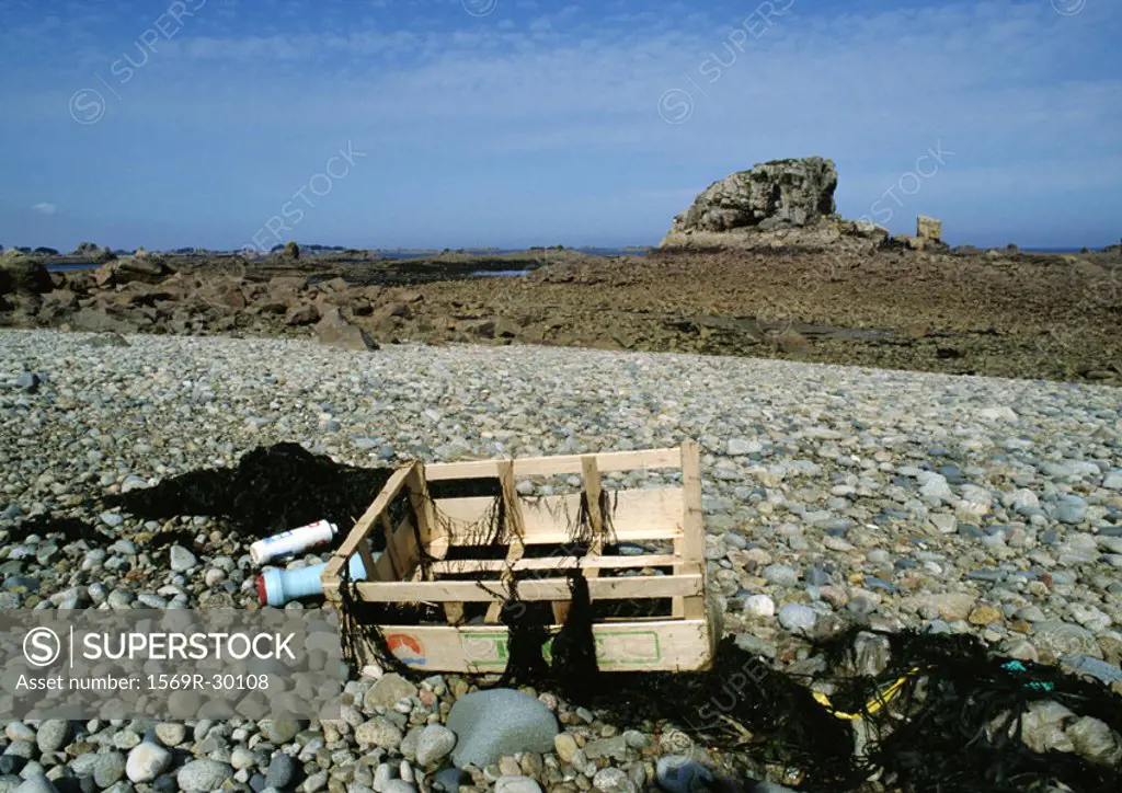 Crate and plastics on rocky terrain