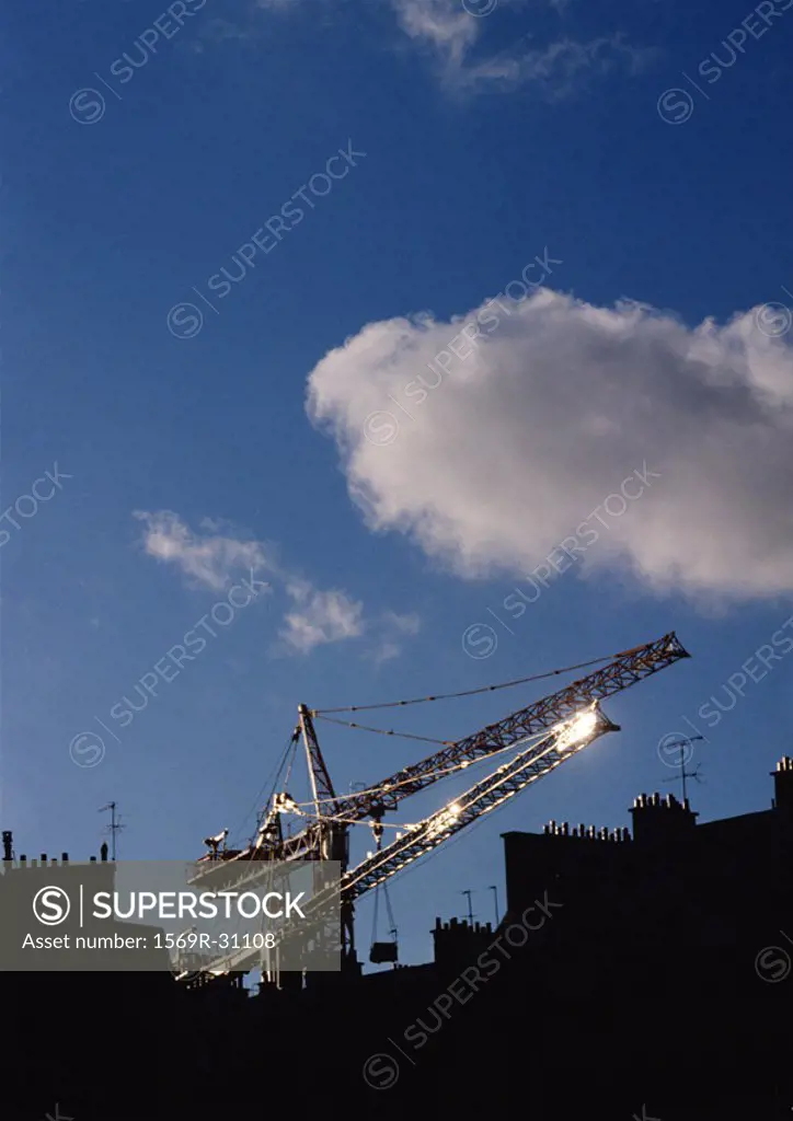 Cranes above rooftops